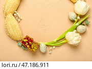 Рамка из цветов, яиц и угощений на бежевом фоне. Празднование Новруз Байрам. Стоковое фото, фотограф Pixel_shot / Фотобанк Лори
