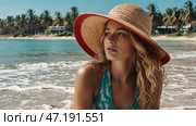 A woman on vacation, sitting in a swimsuit and a wide-brimmed straw hat on the beach on a sunny day and looking at the sea. Стоковое AI-изображение, AI-художник Photojuli / Фотобанк Лори