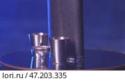 The rotation of a metal flask for alcohol. Стоковое видео, видеограф Потийко Сергей / Фотобанк Лори
