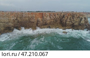 Aerial view on Atlantic coast cliffs and waves. Стоковое видео, видеограф Михаил Коханчиков / Фотобанк Лори