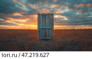 Giant wooden pallet door stands alone in a vast, open field at sunset with dramatic clouds overhead. Гигантская дверь из деревянных паллет установлена посреди обширного поля во время заката. Небо наполнено яркими красками и драматическими облаками, создающими потустороннюю атмосферу. Стоковое AI-изображение, AI-художник Katsiaryna Repich / Фотобанк Лори