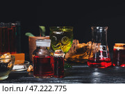 Различные зелья на столе алхимика. Стоковое фото, фотограф Pixel_shot / Фотобанк Лори