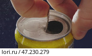To successfully open a carbonated beverage can, one typically uses a convenient pull tab mechanism. Стоковое видео, видеограф Владимир Ковальчук / Фотобанк Лори