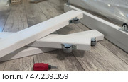 Wooden ottoman elements with wheels. Assembling furniture at home. Стоковое видео, видеограф Vadzim Yakubovich / Фотобанк Лори