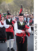 St. Patrick's day celebration parade - musicians in Irish kilts with bagpipes marching in the street (2024 год). Редакционное фото, фотограф Дмитрий Рухленко / Фотобанк Лори