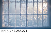 Frosted windowpanes reveal a serene winter landscape bathed in soft sunlight during a quiet morning. Стоковое AI-изображение, AI-художник Сергей Толмачёв / Фотобанк Лори