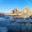 Morning on Lake Baikal during spring ice drift. View of famous Shamanka Rock - natural landmark of Olkhon Island. Bay is covered with thin transparent crust of blue ice. Scenic landscape. Change seasons. Стоковое фото, фотограф Виктория Катьянова / Фотобанк Лори