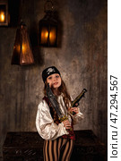 Young Pirate Adventurer Poses in a Mysterious Setting Filled With Treasures and Secrets. Стоковое фото, фотограф Aleksandr Golubev / Фотобанк Лори