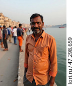 A man stands along the banks of the Ganges River in Varanasi, surrounded by vibrant activity Generative AI. Стоковое AI-изображение, AI-художник Юлия Петровская / Фотобанк Лори