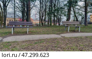 Serene and Inviting Park Benches Surrounded by Beautiful Nature and Lush Greenery. Стоковое видео, видеограф Vladimir Vintonjak / Фотобанк Лори