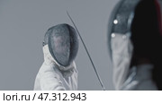 Fencing - two young women fencers having a training fight. Стоковое видео, видеограф Константин Шишкин / Фотобанк Лори