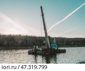 Crane vessel, crane ship, crane barge, or floating crane is a ship with a crane specialized in lifting heavy loads. Стоковое фото, фотограф Константин Григорьев / Фотобанк Лори