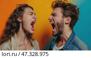 Angry young adult Caucasian woman yelling versus her husband on color background, Young couple arguing and fighting. Domestic violence, emotional abuse scene of woman and man screaming at each other. Стоковое AI-видео, аниматор Sergey Grishin / Фотобанк Лори