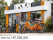 A bicycle or scooter rental point or point. Rent, hire, business. Russia, Moscow region, June 23, 2024. Редакционное фото, фотограф Photojuli / Фотобанк Лори