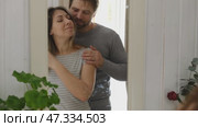 Mature couple hugging hugging each other kissing at home bedroom. Intimate Moment. Tender embrace shared between a loving middle age man and woman, husband and wife. Deep love. Low key, cinematic. Стоковое видео, видеограф Марина Демидюк / Фотобанк Лори