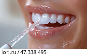 Woman's mouth with a water flosser and water jet, isolated on a white background. Рот женщины с водяным флоссером и струей воды, изолированные на белом фоне. Стоковое AI-изображение, AI-художник Katsiaryna Repich / Фотобанк Лори