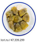 Artichoke cores baked in oven are served with spicy garlic alioli sauce. Стоковое фото, фотограф Яков Филимонов / Фотобанк Лори