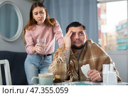 Sick man sitting with wife at home. Стоковое фото, фотограф Яков Филимонов / Фотобанк Лори