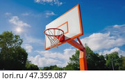 Basketball hoop on the outdoor playground on a sunny day. Стоковое AI-видео, аниматор Ирина Старикова / Фотобанк Лори