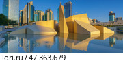 Abu Dhabi, United Arab Emirates - Jan 10 2024, Panoramic view of the square with the Al Musallah public space, built by the CEBRA, with skyscrapers in background, Abu Dhabi, United Arab Emirates. Редакционное фото, фотограф Сергей Богомяко / Фотобанк Лори