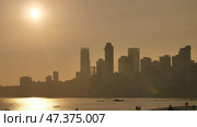 Sunset on the background of Mumbai skyscrapers. View from Chowpatty Beach. Стоковое фото, фотограф Mikhail Davidovich / Фотобанк Лори
