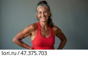 Discovering Strength and Vitality in Fitness While Smiling in a Bright and Inviting Studio Setting. Стоковое AI-изображение, AI-художник Sergey Grishin / Фотобанк Лори