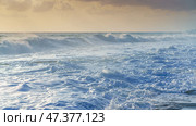 Alanya, Antalya, Türkiye, Turkey, Panoramic view of the storm, large waves with sea foam rolling onto the beach, at sunset, the Mediterranean Sea (2023 год). Стоковое фото, фотограф Сергей Богомяко / Фотобанк Лори