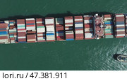 Cargo ship filled with containers in port area. Стоковое видео, видеограф Михаил Коханчиков / Фотобанк Лори
