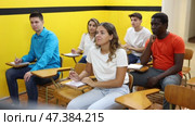 Different aged multiracial men and women studying in taxi driving school. Стоковое видео, видеограф Яков Филимонов / Фотобанк Лори