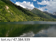 View of Lake Tumanly-Gel (Foggy Lake) in the valley of the Gonachkhir River on the territory of the Teberdinsky National Park on a sunny summer day, Dombay, Karachay-Cherkessia, Russia. Стоковое фото, фотограф Ula Ulachka / Фотобанк Лори