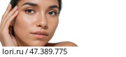 Closeup portrait young woman touching face, flawless skin, natural makeup, healthy glow, beauty care concept, skincare routine, smooth complexion, fresh look, spa treatment. Стоковое AI-изображение, AI-художник Павел Муравьев / Фотобанк Лори