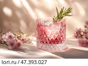 Refreshingly Colorful Cocktail Served in a Crystal Glass With Floral Accents in Soft Afternoon Light. Стоковое AI-изображение, AI-художник Юлия Гапеенко / Фотобанк Лори