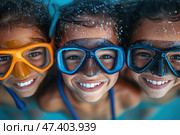 Three smiling children in a pool, wearing brightly colored swimming masks. Their faces are covered in droplets of water, and the mood is clearly carefree and joyful. The shot is taken close-up, creating an effect of closeness and involvement. The colors are rich, with a predominance of blue and skin tones. The atmosphere is summer, vacation, fun, friendship. Стоковое AI-изображение, AI-художник Анна Кривицкая / Фотобанк Лори