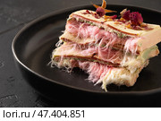 Trendy pink chocolate with airy filling on black plate. Tasty dessert. Стоковое фото, фотограф Светлана Лажко / Фотобанк Лори