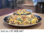 A lenten dish decorated with slices of citrus fruits and chocolate, traditionally consecrated in Orthodox Church during Lent. Стоковое фото, фотограф irisff / Фотобанк Лори