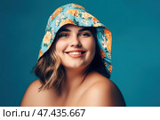 Happy woman in beach hat on blue background, chubby plus size model portrait. Стоковое AI-изображение, AI-художник Станислав Тарко / Фотобанк Лори