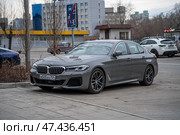KRASNOYARSK, RUSSIA - April 3, 2025: Grey BMW 5-series G30. Редакционное фото, фотограф Плотников Дмитрий / Фотобанк Лори
