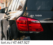 Novosibirsk, Russia -  March  23, 2024: Mercedes-Benz GL-class, view of modern   car xenon lamp taillight, bumper, rear trunk lid. Exterior of a modern car. Стоковое фото, фотограф Виталий Сова / Фотобанк Лори