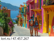 A young couple with backpacks walk along a narrow street surrounded by brightly painted houses. The facades of the buildings are painted in rich shades of pink, yellow, turquoise, orange. Ahead is the azure sea and moored yachts. The atmosphere of the frame conveys the feeling of a summer holiday in a warm, colorful coastal location, perhaps in Latin America or the Mediterranean. Flowers, balconies and shade from the vegetation are everywhere - all this emphasizes the romanticism and picturesqueness of the place. Стоковое AI-изображение, AI-художник Анна Кривицкая / Фотобанк Лори