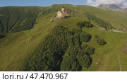 Gergeti Trinity church near mount Kazbek (2022 год). Стоковое видео, видеограф Михаил Коханчиков / Фотобанк Лори