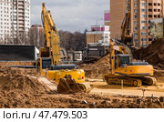 Heavy machinery for excavation and landscaping. Close-up of a road roller on a construction site in the sand. Excavation and road construction. Стоковое фото, фотограф Photojuli / Фотобанк Лори