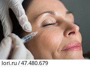 Woman receiving cosmetic treatment in a clinic in a calm setting. Женщина проходит косметические процедуры в клинике в спокойной обстановке. Стоковое AI-изображение, AI-художник Katsiaryna Repich / Фотобанк Лори