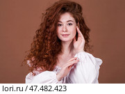 Studio portrait of a red-haired girl. Стоковое фото, фотограф Андрей Аркуша / Фотобанк Лори