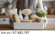 Cleaning supplies and tools organized in a white basket for home chores. Чистящие средства и инструменты для уборки в белой корзине для домашних дел. Стоковое AI-изображение, AI-художник Katsiaryna Repich / Фотобанк Лори