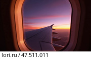 Airplane window view at sunset with gradient sky. Стоковое AI-изображение, AI-художник Андрей Бакусов / Фотобанк Лори