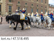 STOCKHOLM, SWEDEN - APRIL 30, 2018: Life Guards' Dragoon Music Corps on Slottsbacken street. The Royal Swedish Cavalry Band (Livgardets Dragonmusikkår). The celebration of King Carl XVI Gustaf 72 years old, at the Royal Palace in Stockholm. Редакционное фото, фотограф Сергей Комаров / Фотобанк Лори