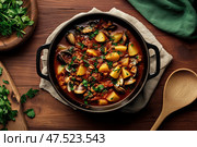 An enticing overhead shot of Manhattan Clam Chowder highlights its vibrant tomato base. The broth is rich with tender clams, potatoes, and herbs, making it a mouth-watering hearty dish. Стоковое AI-изображение, AI-художник Nart / Фотобанк Лори