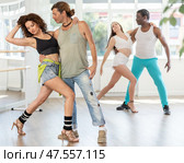 Woman dances incendiary tango with man partner during choreography lesson. Стоковое фото, фотограф Яков Филимонов / Фотобанк Лори