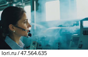 Control room operator communicates effectively through headset while working in a smoky environment during crucial operations. Стоковое AI-видео, аниматор Данила Большаков / Фотобанк Лори