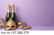 Celebrate Purim With Champagne, Festive Masks, and Noisemakers Against a Lilac Background Perfect for a Joyous Occasion. Стоковое AI-изображение, AI-художник Sergey Grishin / Фотобанк Лори